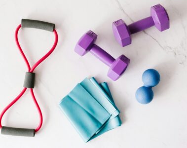 set of fitness equipment placed on marble surface
